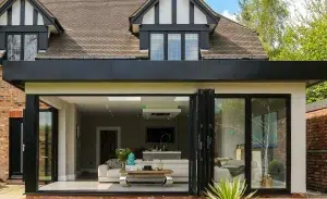 WeatherMaster bi-fold doors opening onto an outdoor living space.