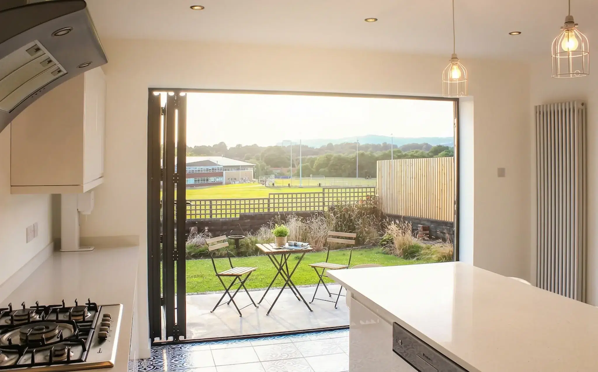 WeatherMaster bi-fold doors opening onto an outdoor living space.